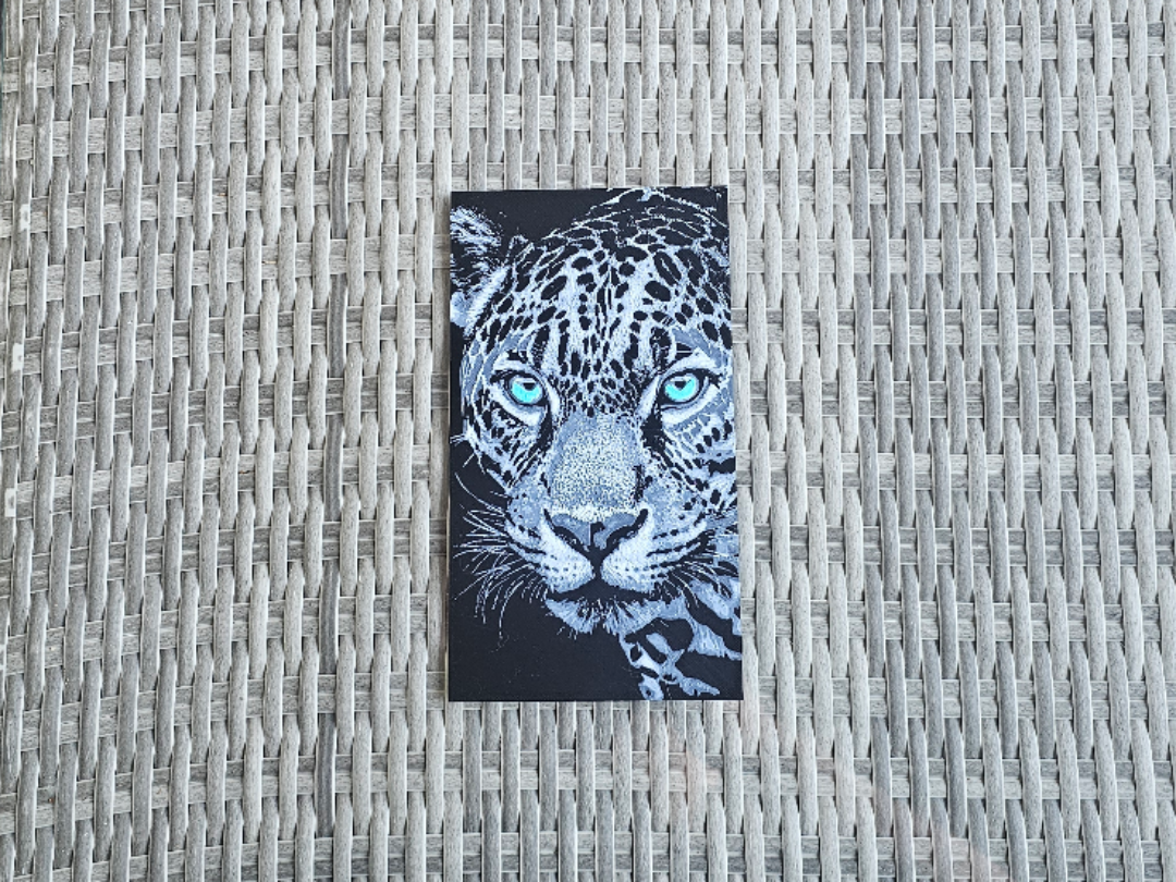 Leopard mit leuchtenden Augen Tier Hueforge