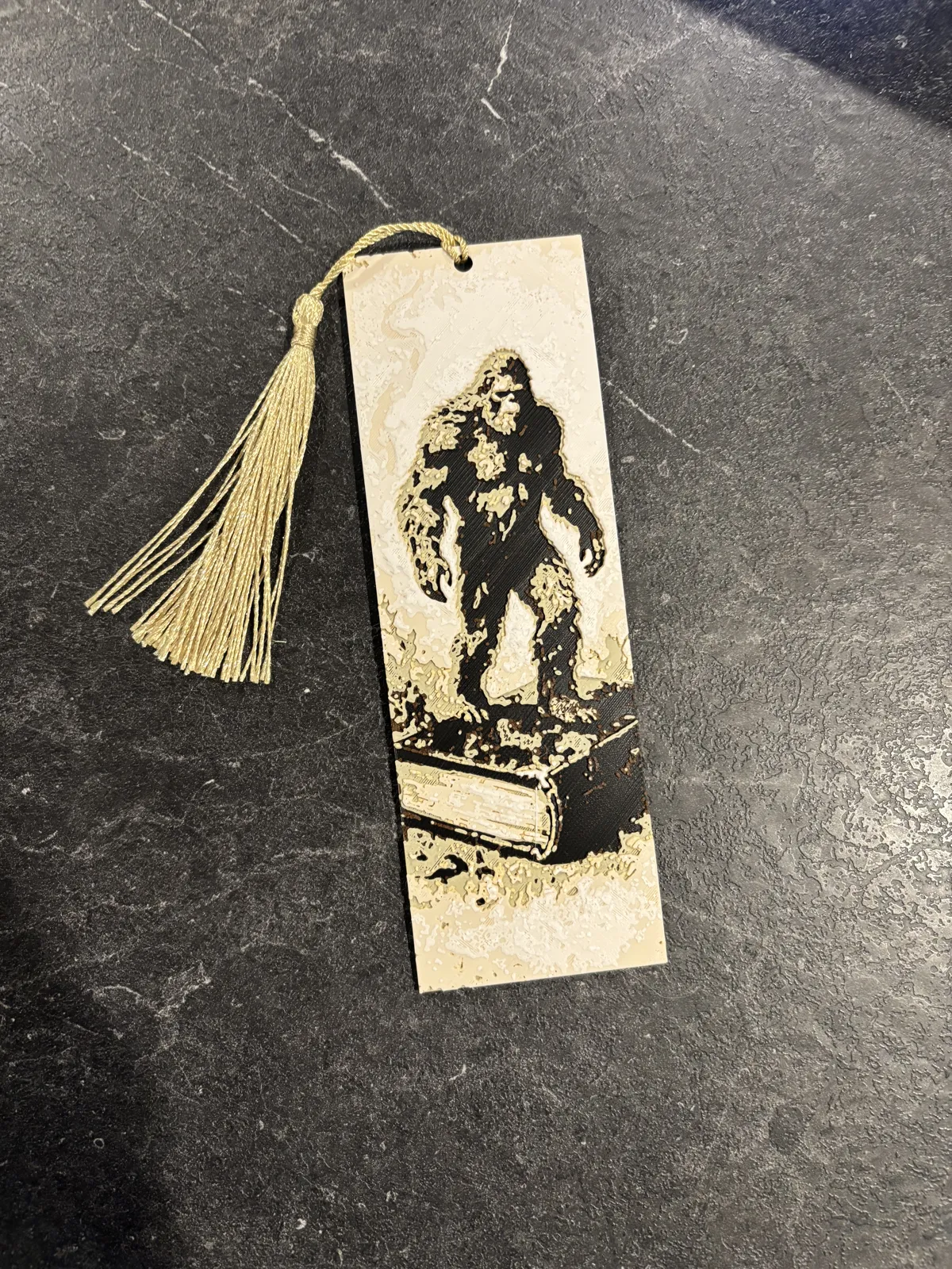Bigfoot on a book bookmark hueforge