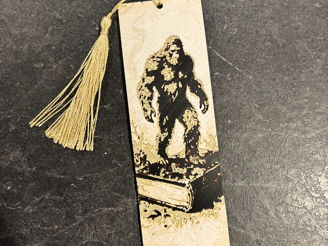 Bigfoot on a book bookmark hueforge